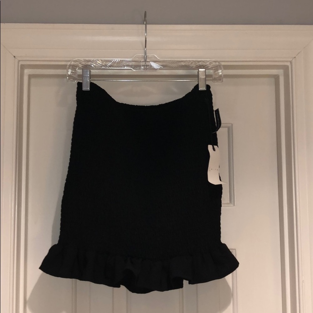 Black tube skirt with ruffle at the bottom